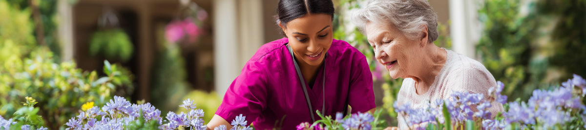 Caregiver helping senior woman with garden at home in Dallas TX